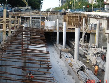 Track slab poured and columns completed in center of station. Exposed starter bars are in place for the roof.