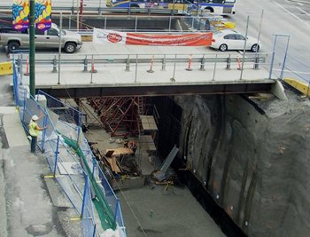 Temporary bridges for eastbound and westbound traffic on King Edward Ave. extends over excavated Phase A of King Edward Station. Following completion of construction for Phase A, bridges are removed and vehicle traffic is shifted to the east side of Cambie St. to accommodate Phase B construction on the west side.
