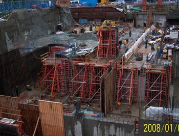 Track slab, columns and platform wall poured with curing protection in place.