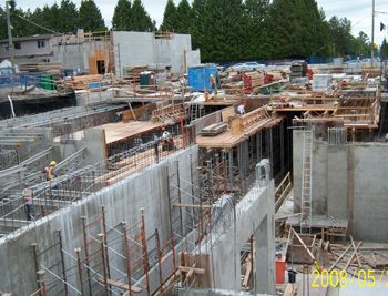 Preparation underway for north end roof slab. Fifty-percent of the station entrance building construction is now complete with glass and metalwork remaining.