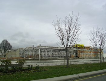 Scaffoldings and concrete forms prepare for Sea Island Centre Station to take its shape.