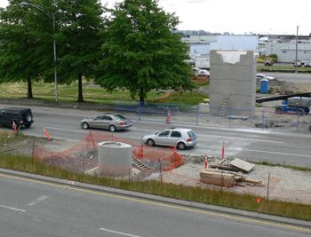 Workers prepare the South passenger access support as well as the mid-span support in the median of Grant McConachie Way.
