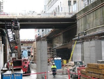Installation of one vehicle and pedestrian bridge -- extending over the excavation site at Hastings Street -- and two utility bridges, one north of Hastings and one south of Hastings to carry existing utilities: Hydro, TELUS, steam, gas, water, storm and sanitary sewer.
