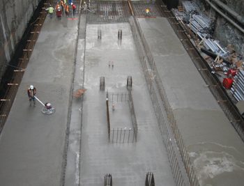 The construction of Waterfront Station required 7000 cubic metres of concrete for the base slab, passenger platform, track base, concourse level, and the grade level (roof) slabs as well as the interior walls and structural columns.
